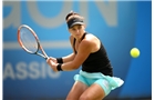 BIRMINGHAM, ENGLAND - JUNE 13:  Casey Dellacqua of Australia in action against Kimiko Date-Krumm of Japan during Day Five of the Aegon Classic at Edgbaston Priory Club on June 13, 2014 in Birmingham, England.  (Photo by Jordan Mansfield/Getty Images for Aegon)